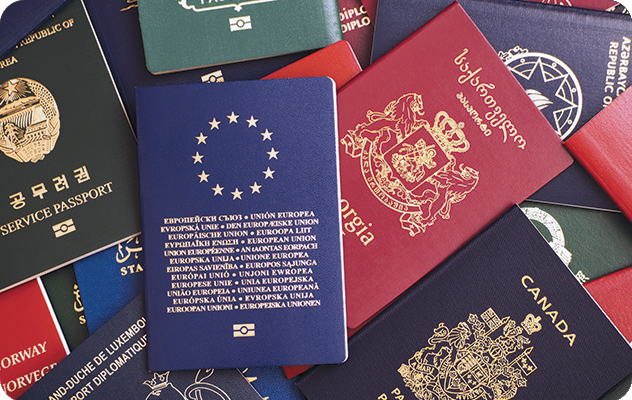 A picture of various international passports which iTi can help translate. iTi offers certified document translation for important personal documents.