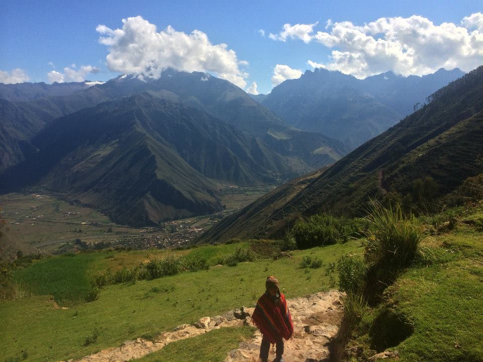 Young Peruvian standing in the mountains