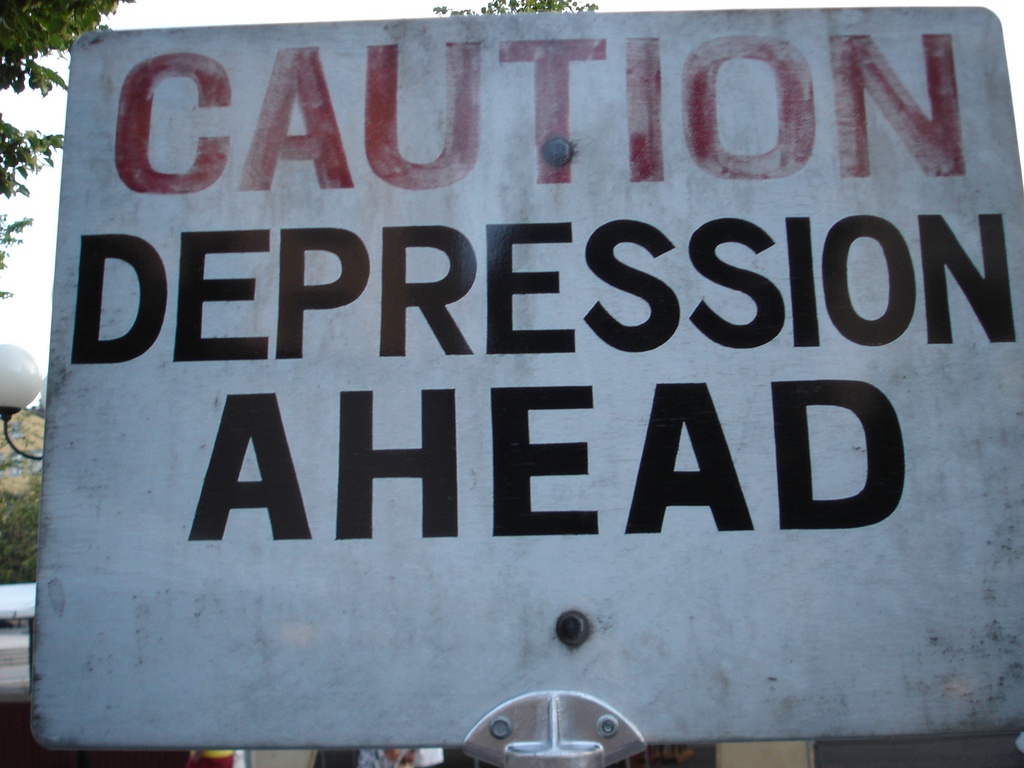 Sign that says caution depression ahead