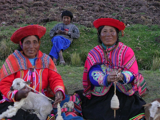 indigenous quechua women holding goats