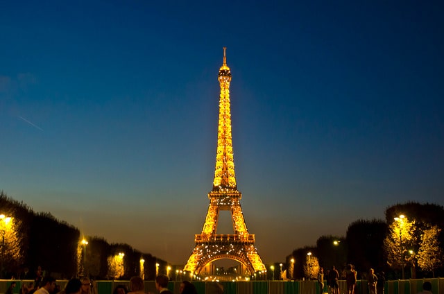 Eiffel Tower lit up at dusk