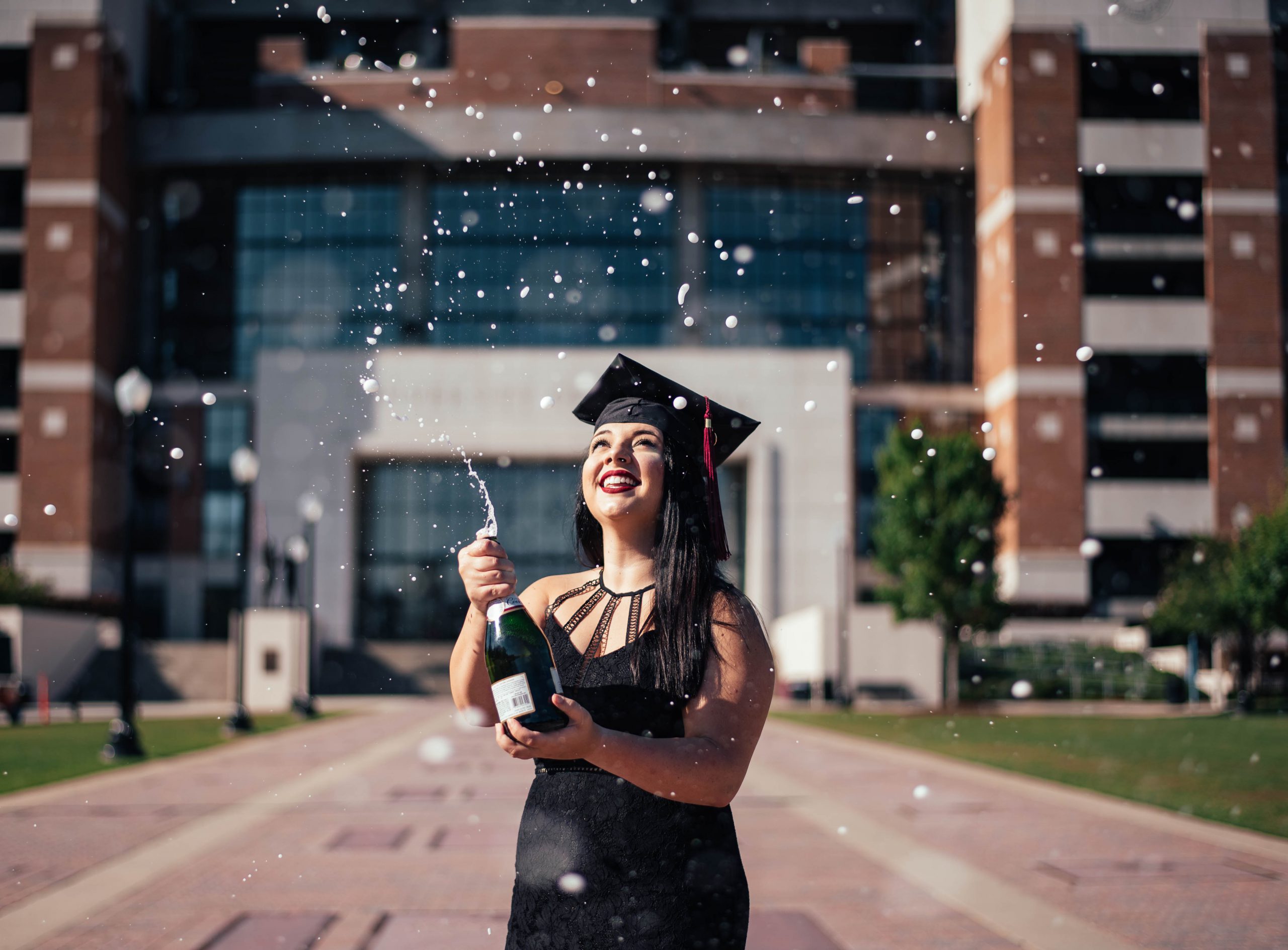 Student Popping Champagne at Graduation - University Language Degrees