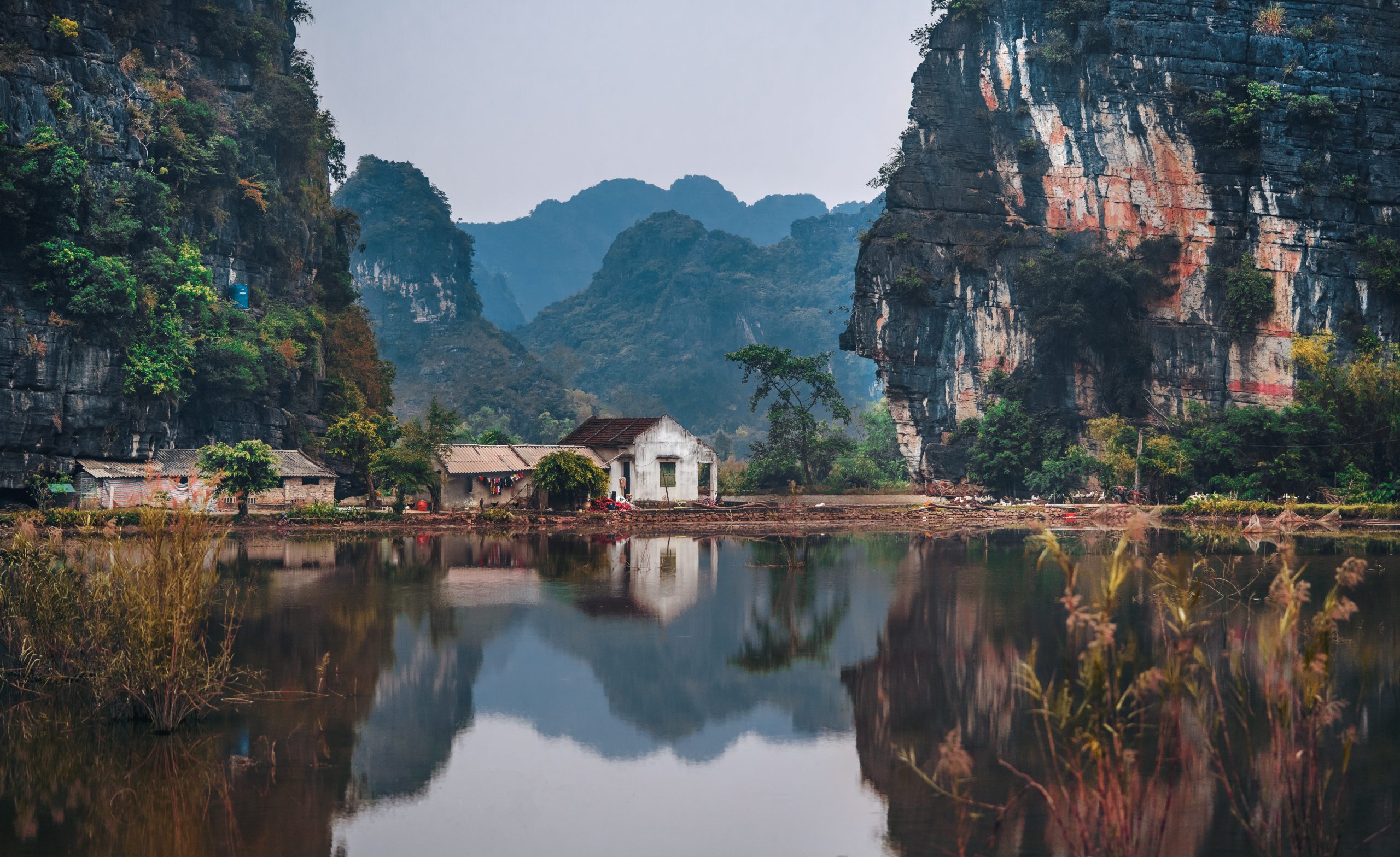 Vietnam mountains with lake and house in front