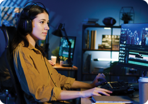 A picture of a woman working in a video editing office on video translation services.