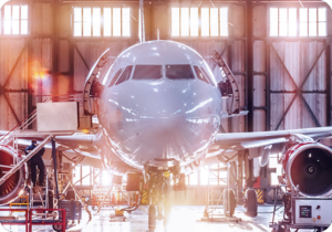 A picture of an airplane in a hangar. iTi provides interpreting and translation services for aerospace and defense.