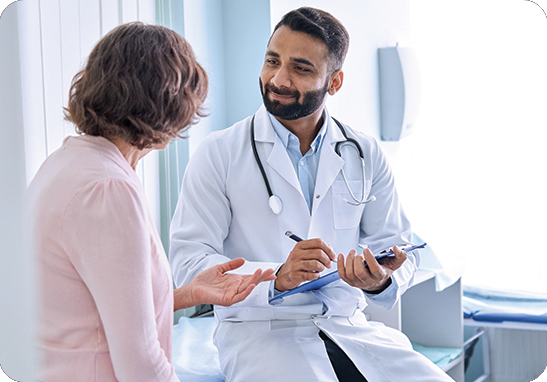 A picture of a doctor helping a patient in a mental health setting. iTi provides language services for mental health and addiction facilities.