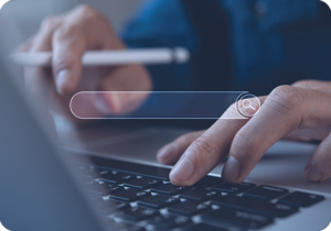 A picture of hands typing on a laptop with a virtual search bar being displayed,