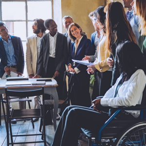 A picture of a meeting of a group of diverse business people.